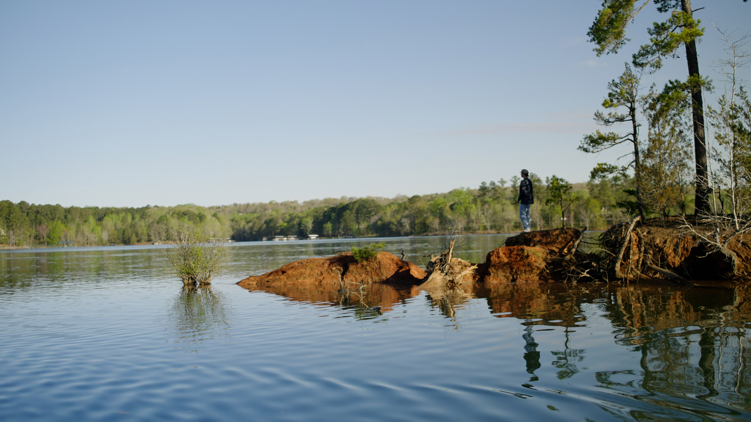 Connor looking over the calm and peaceful lake.
